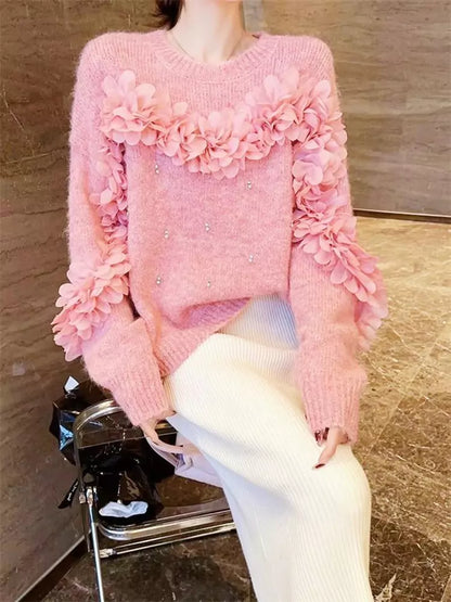 Suéter rosa con flores 3D y adornos de diamantes de imitación: tejido único y elegante.