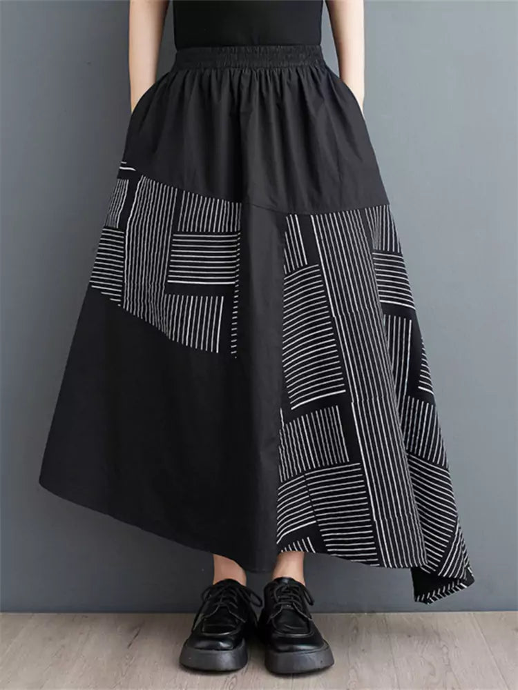 Schwarzer, bedruckter, lockerer Patchwork-Rock in asymmetrischer A-Linie für Damen
