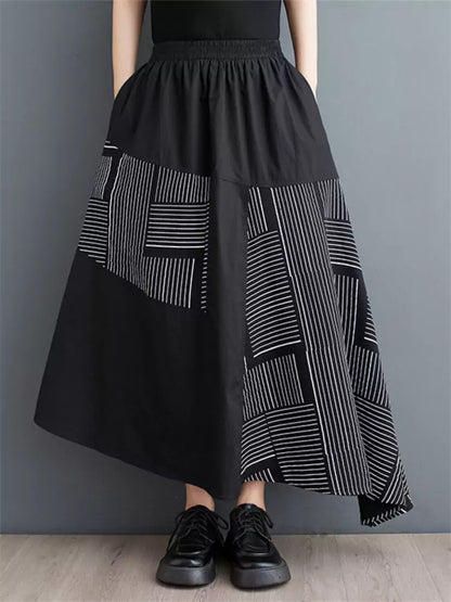 Schwarzer, bedruckter, lockerer Patchwork-Rock in asymmetrischer A-Linie für Damen