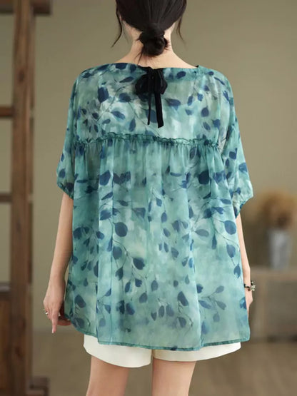 Sommerliches Babydoll-Top mit Blumenmuster und Bindeband am Rücken in großen Größen für Damen