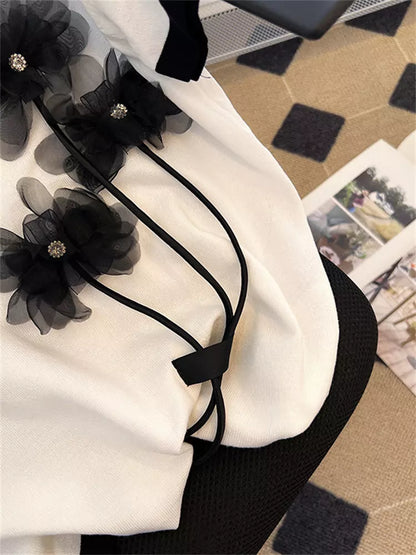 Schickes Damen-T-Shirt mit 3D-Blumenmuster und kontrastierendem Saum, kurzärmelig