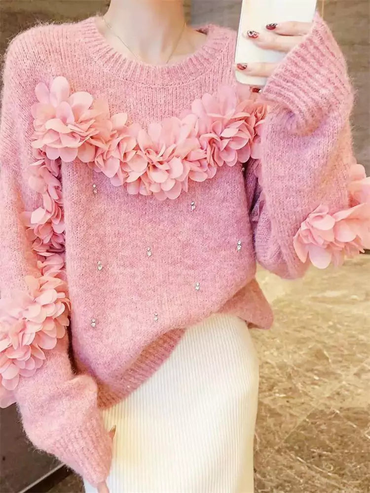 Suéter rosa con flores 3D y adornos de diamantes de imitación: tejido único y elegante.