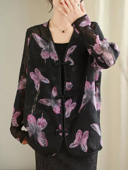 Schwarze, bedruckte Bluse mit V-Ausschnitt und Froschknöpfen für Damen