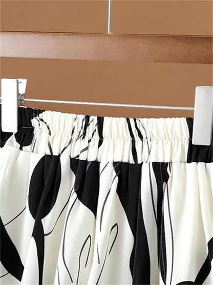 Hochtaillierter, fließender Chiffon-Midirock mit künstlerischem Tintenwasch-Print