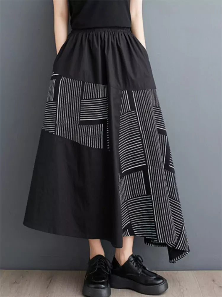 Schwarzer, bedruckter, lockerer Patchwork-Rock in asymmetrischer A-Linie für Damen