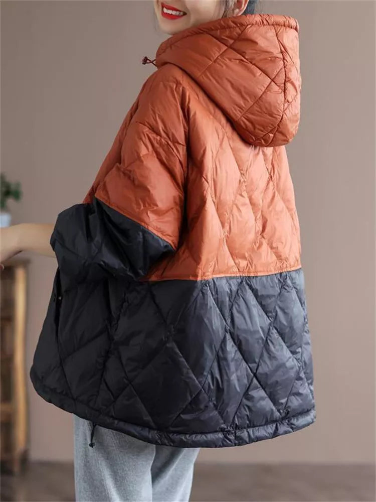 Locker geschnittene, graue Stepp-Daunenjacke mit Kapuze und Farbblockmuster für Damen