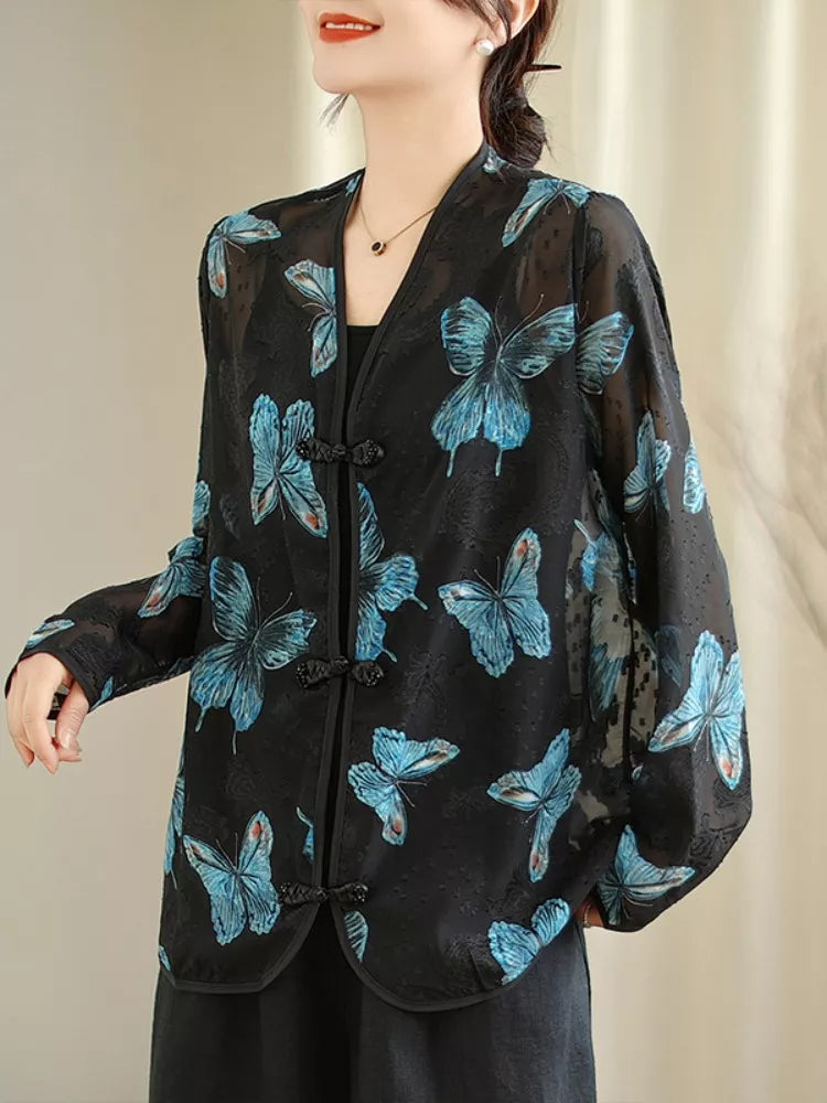 Schwarze, bedruckte Bluse mit V-Ausschnitt und Froschknöpfen für Damen