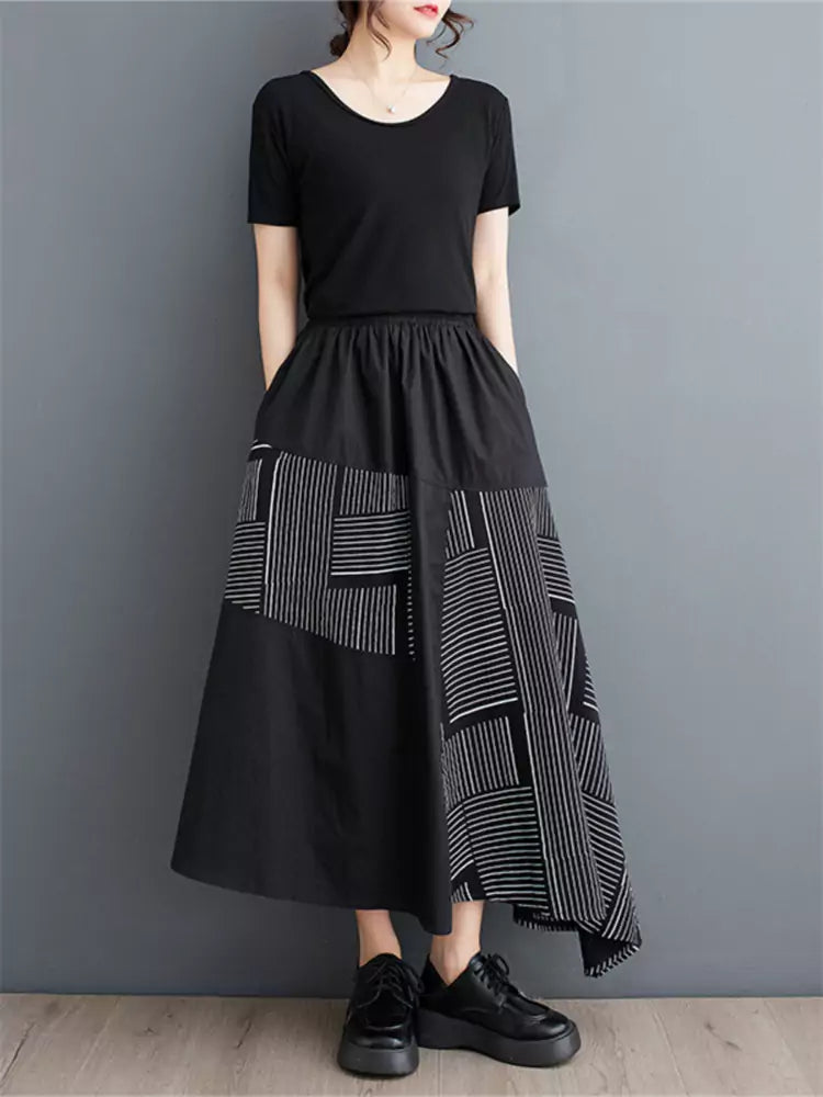 Schwarzer, bedruckter, lockerer Patchwork-Rock in asymmetrischer A-Linie für Damen