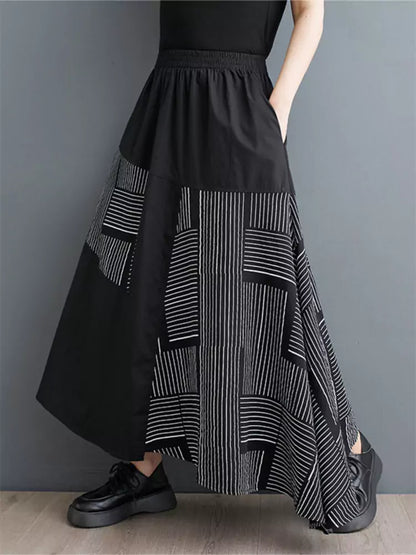Schwarzer, bedruckter, lockerer Patchwork-Rock in asymmetrischer A-Linie für Damen