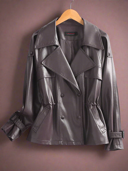 purple leather jacket on a hanger against a white background