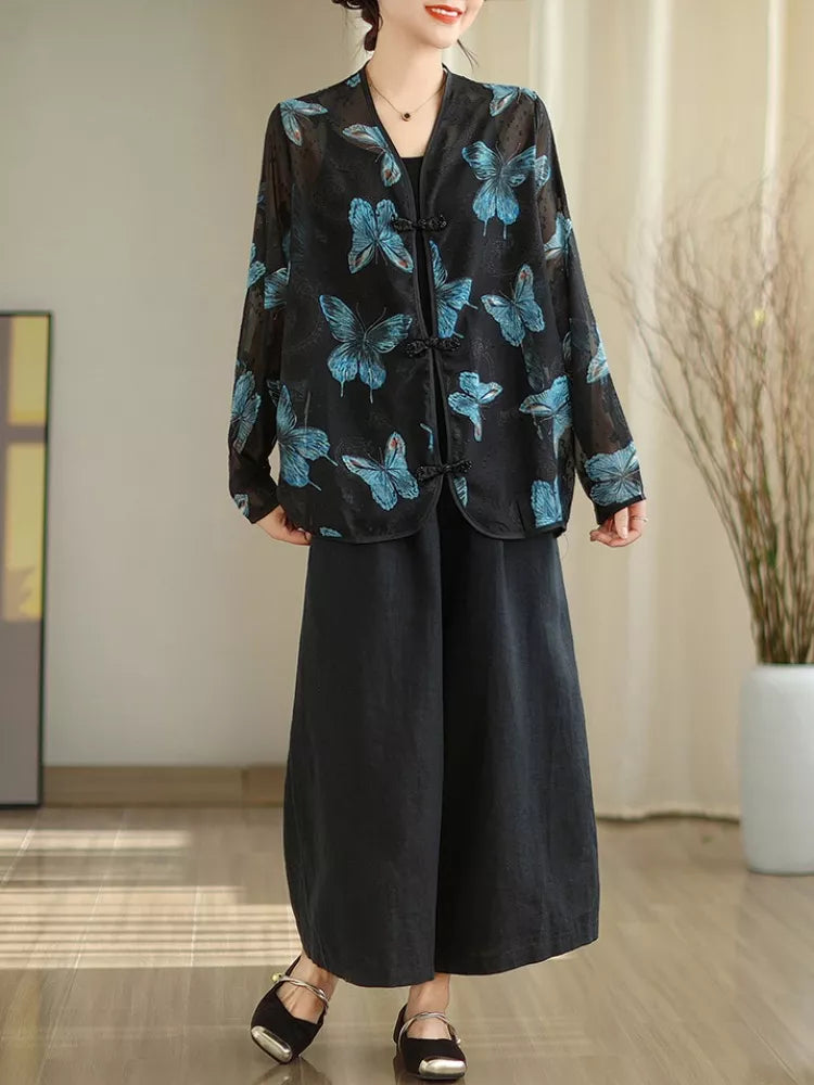 Schwarze, bedruckte Bluse mit V-Ausschnitt und Froschknöpfen für Damen