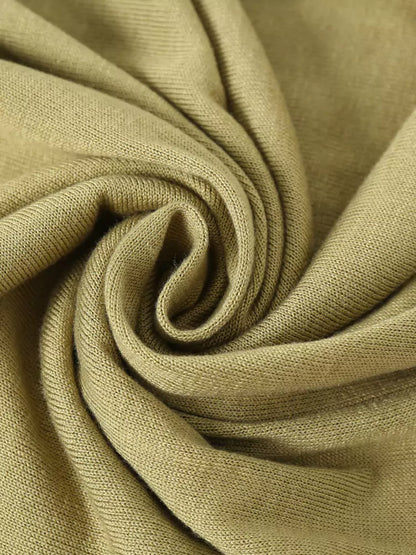 Top de punto con cuello en V y mangas de malla transparente para mujer