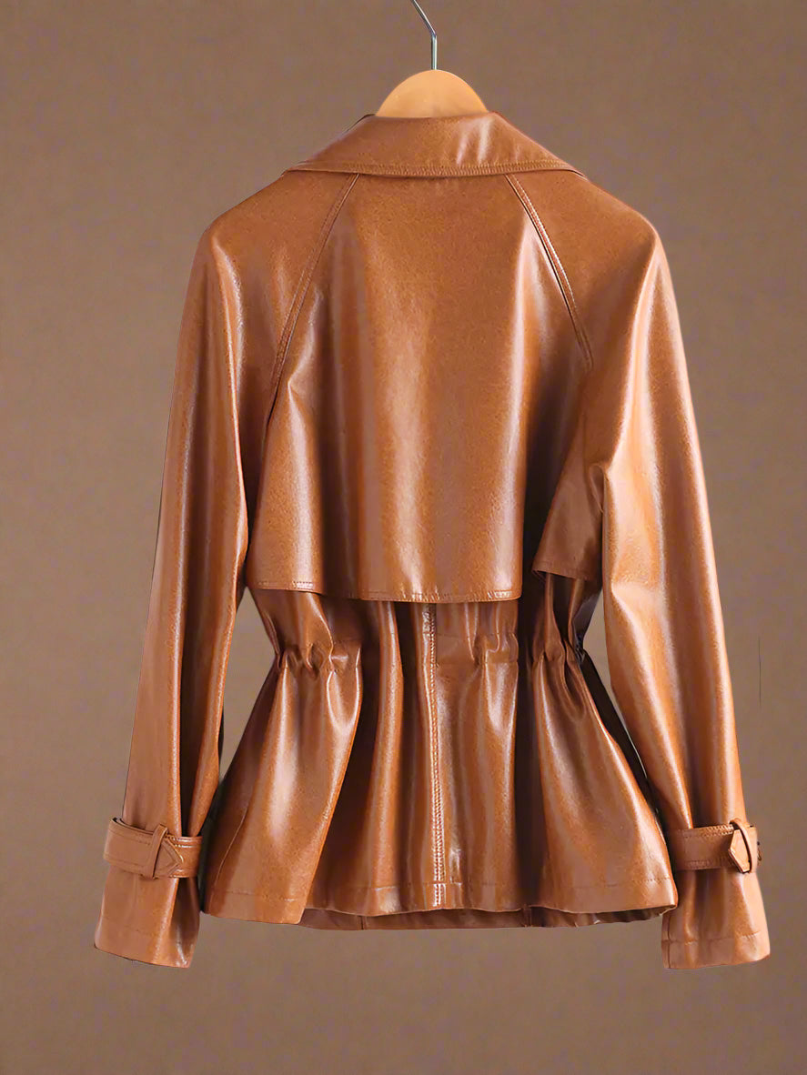 Brown leather jacket on a hanger against a white background