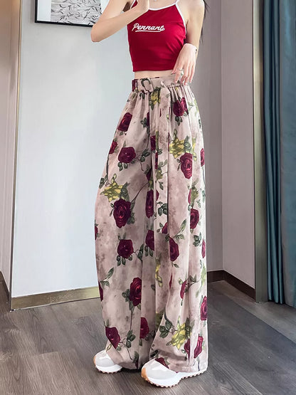 Pantalones anchos de cintura alta con estampado rosa para mujer 