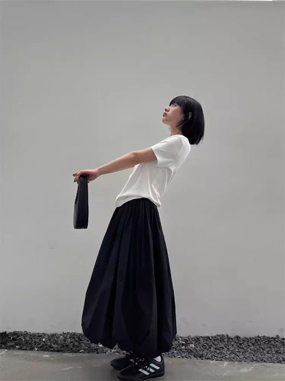 Schwarzer, plissierter A-Linien-Midirock im japanischen Stil für Damen