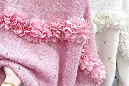 Suéter rosa con flores 3D y adornos de diamantes de imitación: tejido único y elegante.