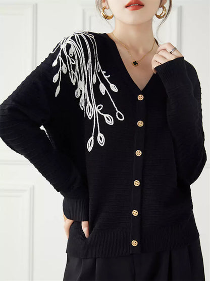 Cárdigan de punto negro con bordado floral de corte holgado