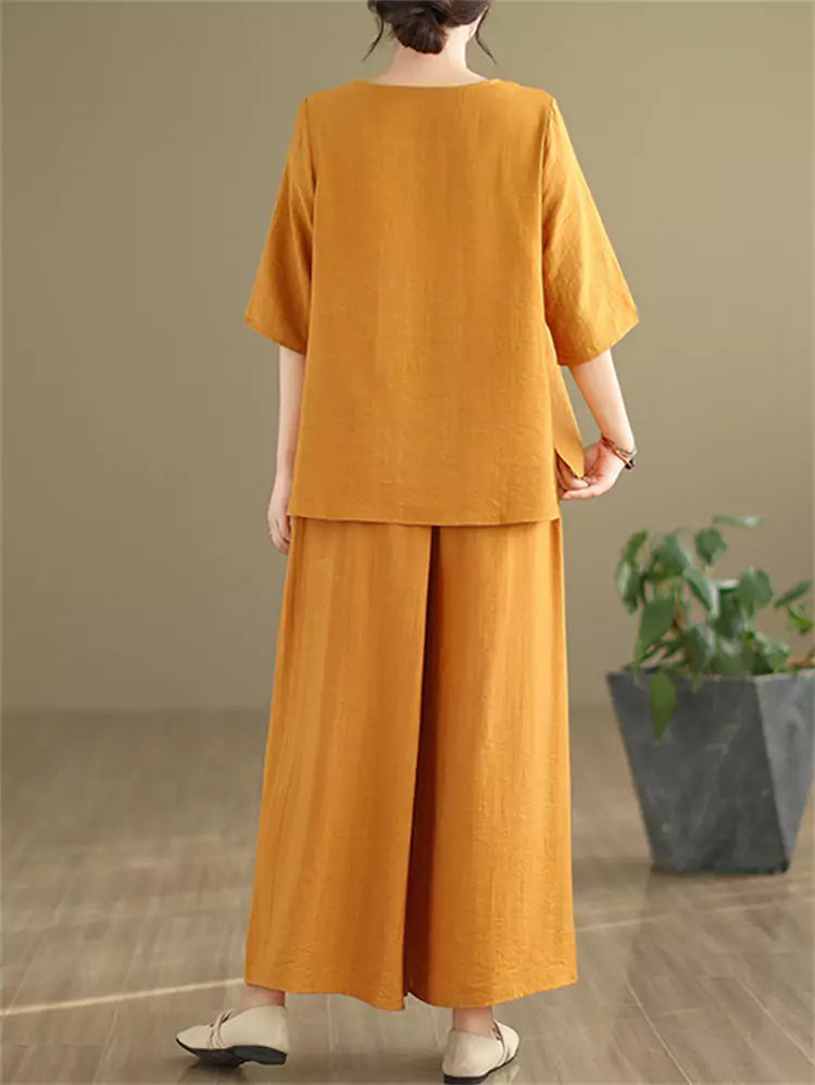 Vintage-Zweiteiler aus besticktem Baumwoll-Leinen-Mix für Damen: Lockere Bluse und weite Hose.