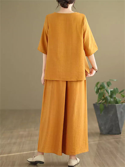 Conjunto de dos piezas de lino y algodón bordado vintage para mujer: blusa holgada y pantalones anchos.