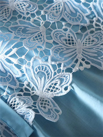 Bestickte Spitzenbluse mit Rüschensaum und kurzen Ärmeln