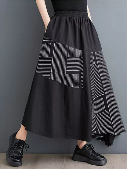 Schwarzer, bedruckter, lockerer Patchwork-Rock in asymmetrischer A-Linie für Damen
