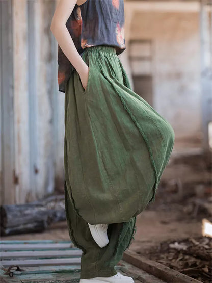 Pantalones vintage de tiro alto y pernera ancha tipo farol: corte holgado de ramio lavado con bajo sin rematar y silueta fluida.