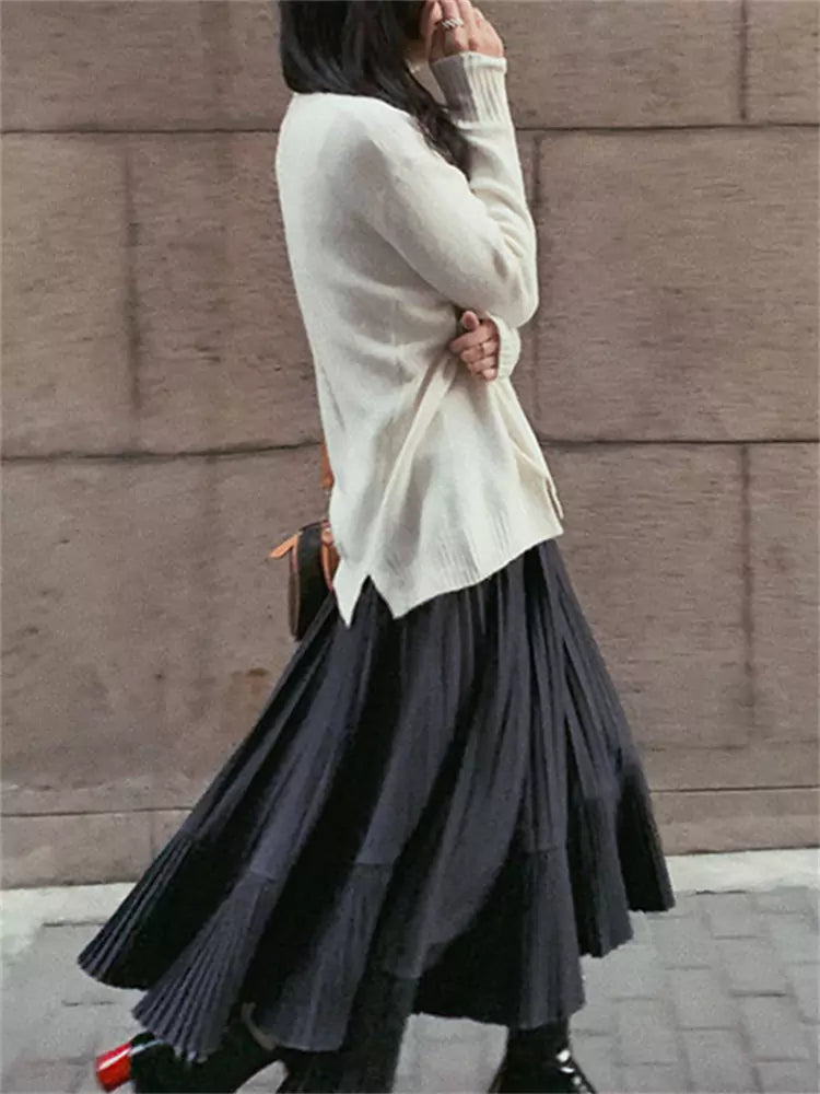 High-Waist Black Pleated Midi Skirt with Irregular Fishtail Hem