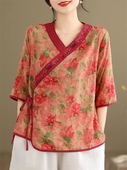 Vintage-Bluse mit orangefarbenem Blumenmuster, seitlichem Verschluss und asymmetrischem Kragen