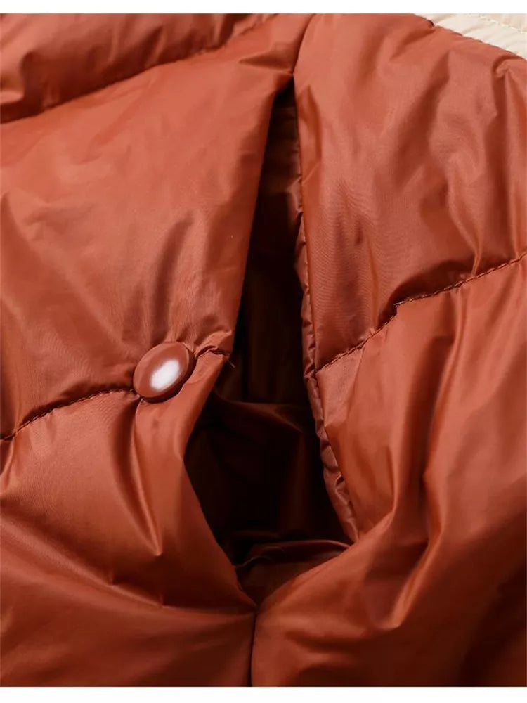 Locker geschnittene, graue Stepp-Daunenjacke mit Kapuze und Farbblockmuster für Damen