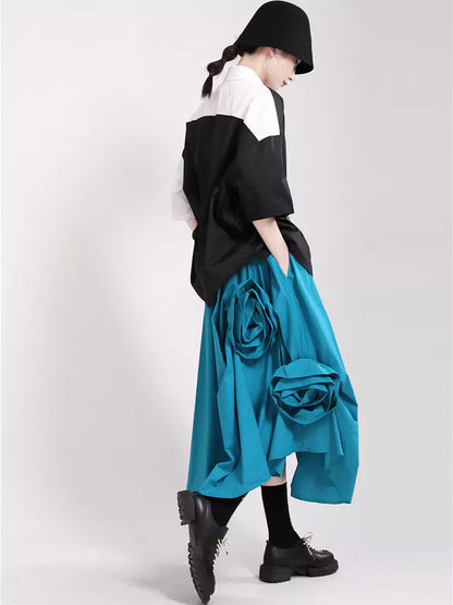 Asymmetrischer, mehrlagiger, plissierter Midirock mit 3D-Rosenapplikation