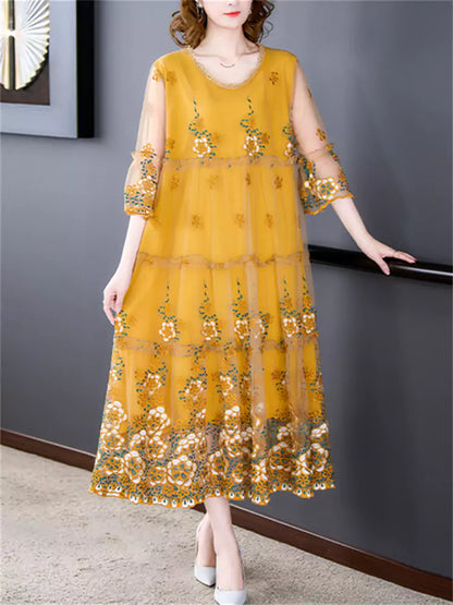 Vestido midi elegante de tul con bordado floral y cuello redondo