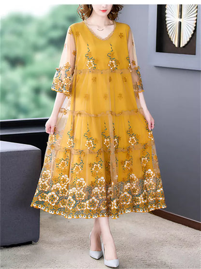 Vestido midi elegante de tul con bordado floral y cuello redondo