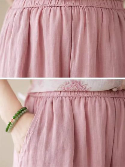 Conjunto de camisa y pantalón de lino con ramio floral: blusa de manga 3/4 y pantalón ancho.