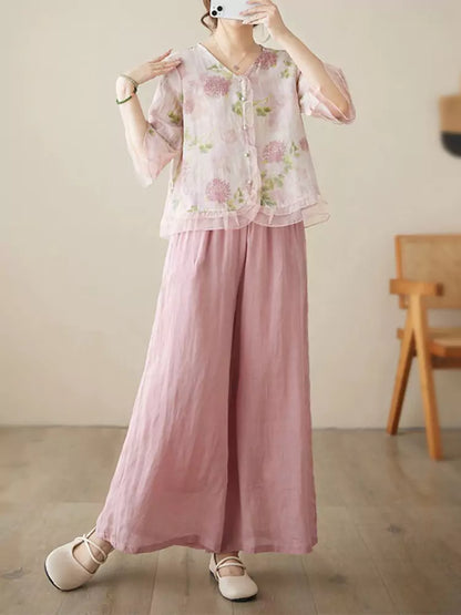 Conjunto de camisa y pantalón de lino con ramio floral: blusa de manga 3/4 y pantalón ancho.