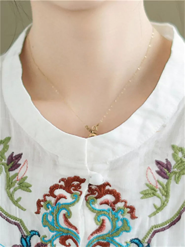 Intricate Embroidered Ramie Babydoll Blouse with Mandarin Collar and Ruffles