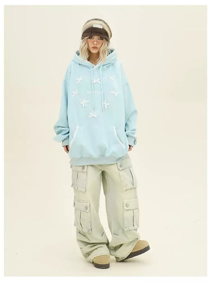 Bonita sudadera con capucha holgada y acogedora con lazo y corazón para otoño