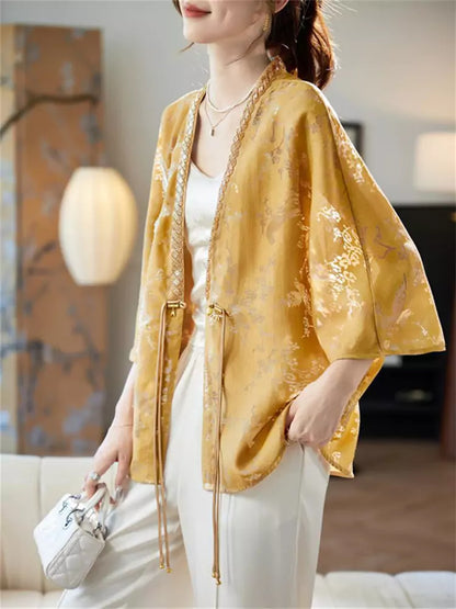 Damenbluse mit lockerer Passform, V-Ausschnitt, Fledermausärmeln und Perlenbesatz sowie Lochstickerei