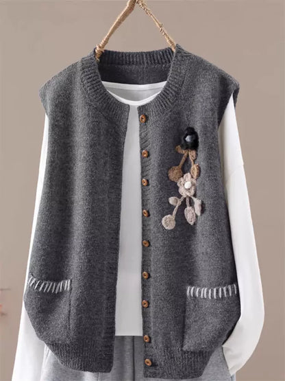 Kurze, lockere, schlichte, einreihige Strickweste mit Rundhalsausschnitt