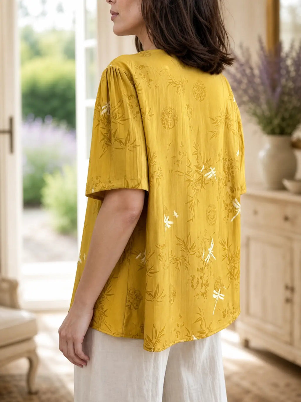 Relaxed V-Neck Tunic with Embroidered Trim & Botanical Print - flat lay view