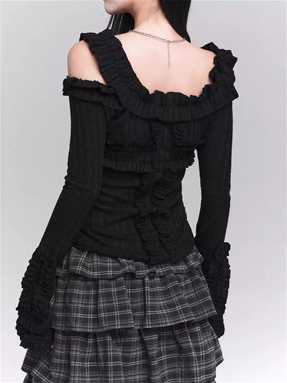 Schickes schwarzes Stretch-Strickoberteil mit Rüschenprint und Glockenärmeln