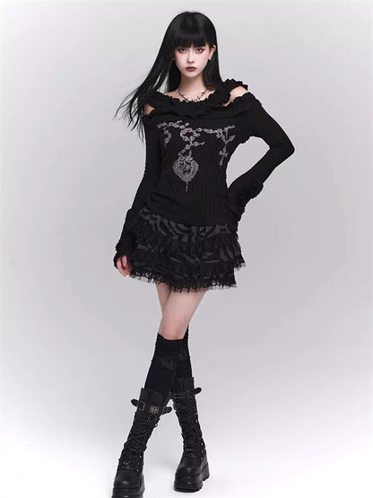 Schickes schwarzes Stretch-Strickoberteil mit Rüschenprint und Glockenärmeln