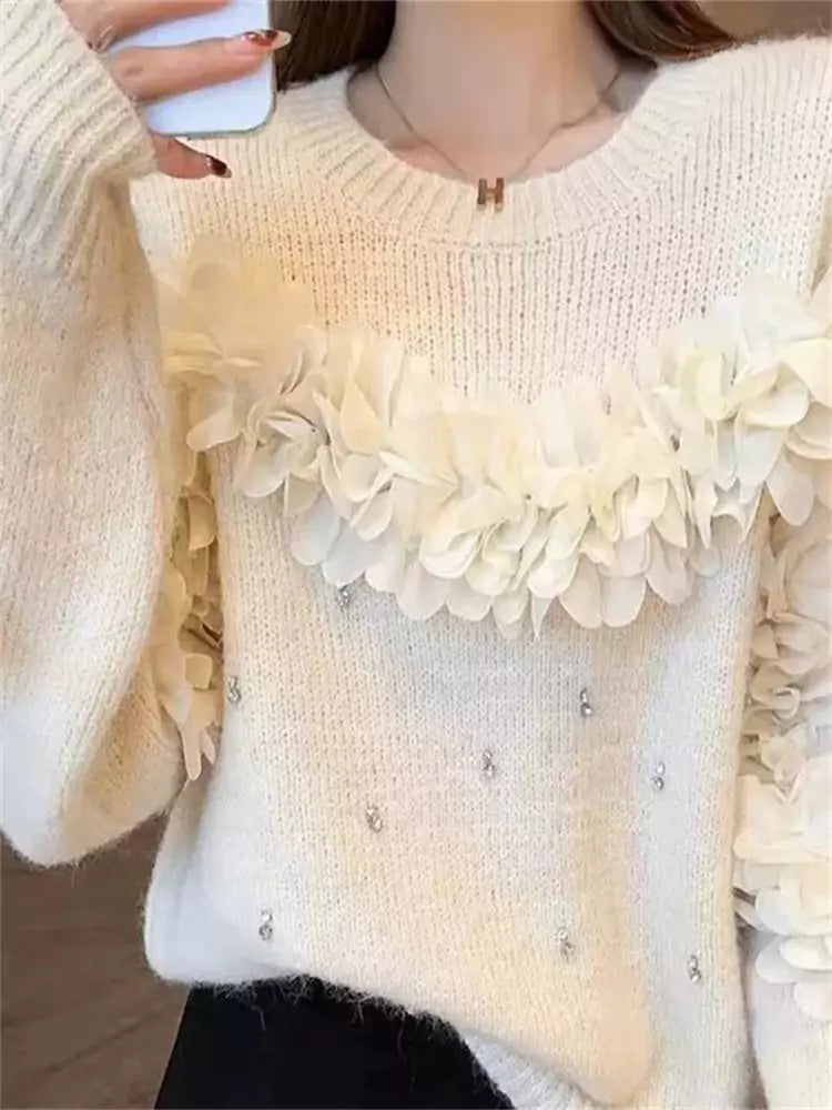 Suéter rosa con flores 3D y adornos de diamantes de imitación: tejido único y elegante.