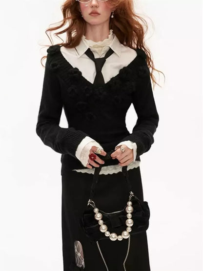 Suéter de punto suave con adorno floral y cintura ajustada