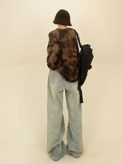 Vaqueros desgastados de pierna ancha con remaches de estrella de estilo urbano