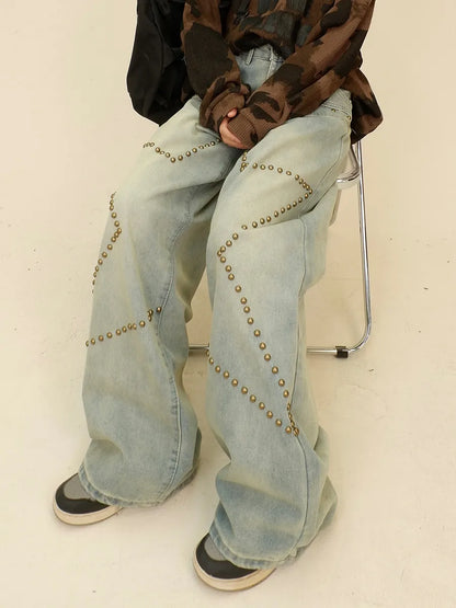 Vaqueros desgastados de pierna ancha con remaches de estrella de estilo urbano