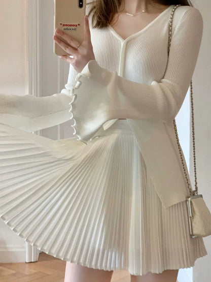 Top de punto ajustado con mangas acampanadas y cuello en V vintage